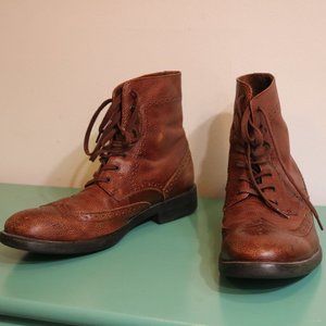 Brown leather wingtip boots